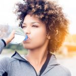 bigstock-Girl-Drinking-Water-From-Bottl-145073507-small-810x540